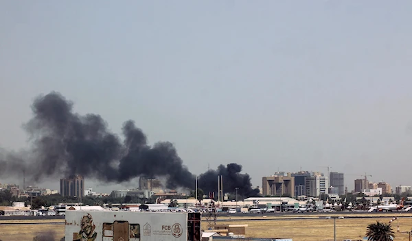 Buildings close to the Khartoum airport burn up in smoke as fighting between the Sudanese Armed Forces and the Rapid Support Forces ensues, Khartoum, Sudan, 15 April 2023. (Reuters)