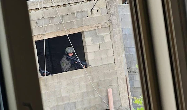 IOF snipper positioned on top of a building in Balata Camp, West Bank, Occupied Palestine 13 May, 2023. (Social Media)