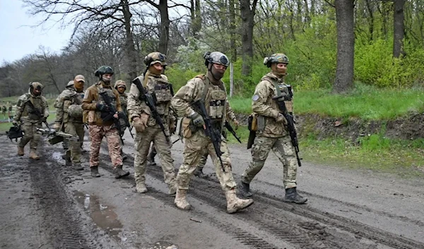 Servicemen in the National Guard of Ukraine take part in military exercises in Kharkiv in April. (AFP)