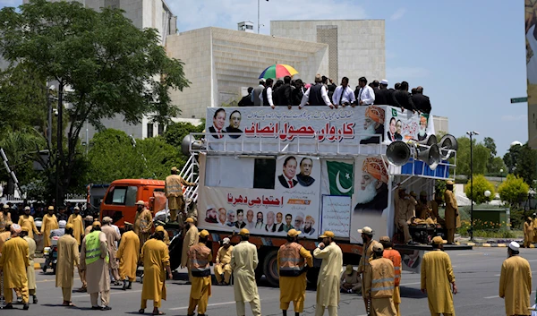 Supporters of Pakistan Democratic Movement, an alliance of the ruling political parties, take part in a rally outside the Supreme Court in Islamabad, Pakistan, Monday, May 15, 2023 (AP Photo/Anjum Naveed)