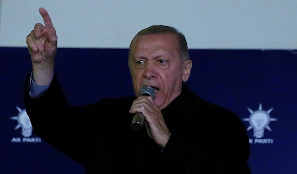 Turkish President Recep Tayyip Erdogan gives a speech at his party's headquarters in Ankara, Turkey, early Monday, May 15, 2023 (AP Photo/Ali Unal)