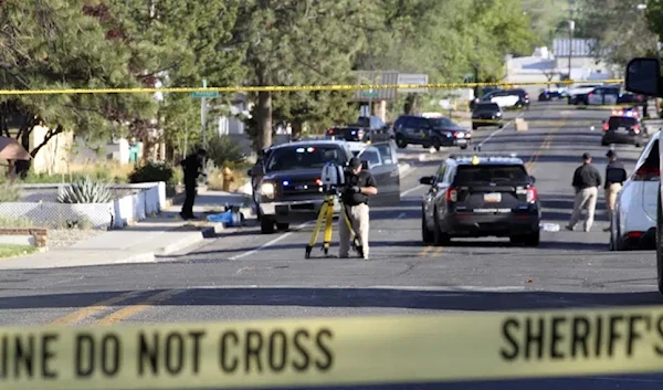 Investigators work along a residential street following a deadly shooting Monday, May 15, 2023, in Farmington. (AP)