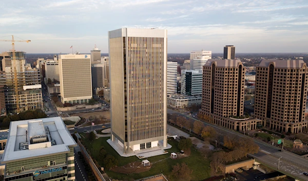 The federal Reserve building, center, rises high over the skyline of Richmond, Va., on Dec. 4, 2017 (AP Photo/Steve Helber, File)