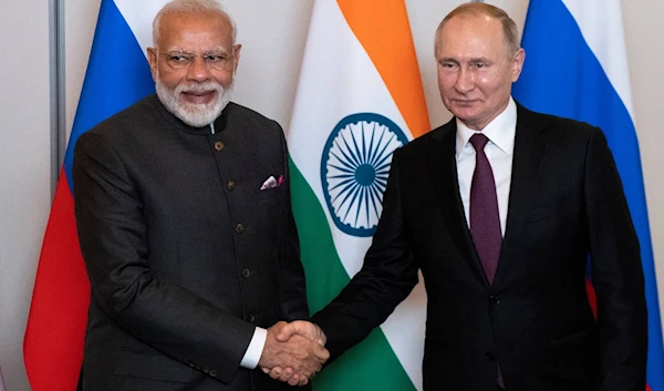 Russian President Vladimir Putin shakes hands with Indian Prime Minister Narendra Modi November 13, 2019 (Reuters)