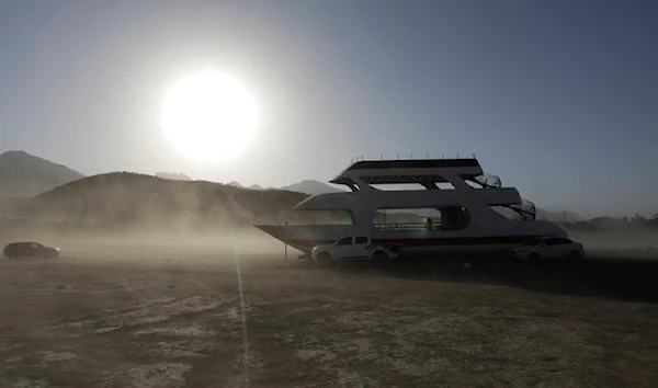 A boat sits on the dried basin of the La Boca dam as more than half of Mexico faces moderate to severe drought conditions, in Santiago, Mexico, March 22, 2022. (Reuters)