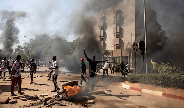 Protestors take to the streets of Burkina Faso's capital Ouagadougou Saturday Nov. 27, 2021. (AP)