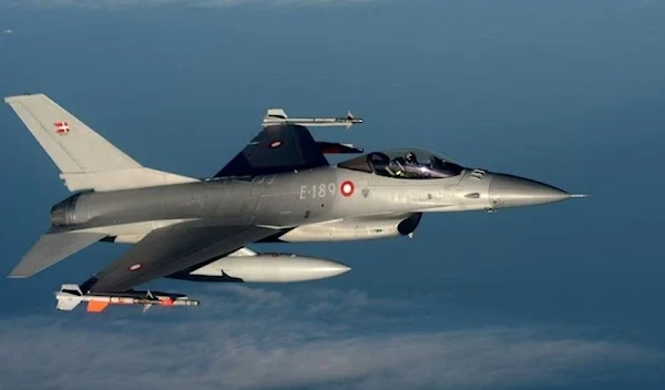 A Danish F16 fighter jet demonstrates the interception of a Belgian air force transport plane as they fly over Denmark, January 14, 2020. (Reuters)