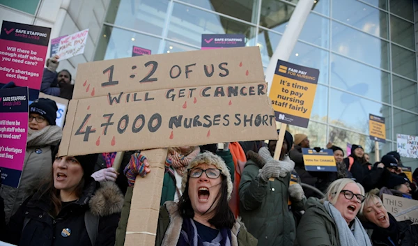 NHS nurses hold banners during a strike, amid a dispute with the government over pay, in London, UK on January 18, 2023 (Reuters)