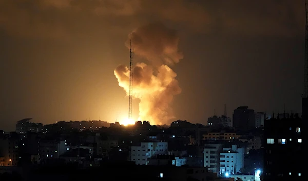 Smoke and fire rise from an explosion caused by an Israeli airstrike on Gaza City, occupied Palestine, May 2, 2023 (AP)