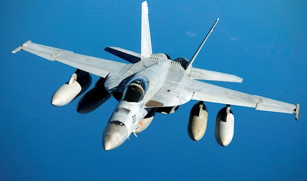 This photo provided by the U.S. Air Force shows a Navy F/A-18 Super Hornet in flight, near the coast of Brisbane, Australia, July 17, 2019 (AP)