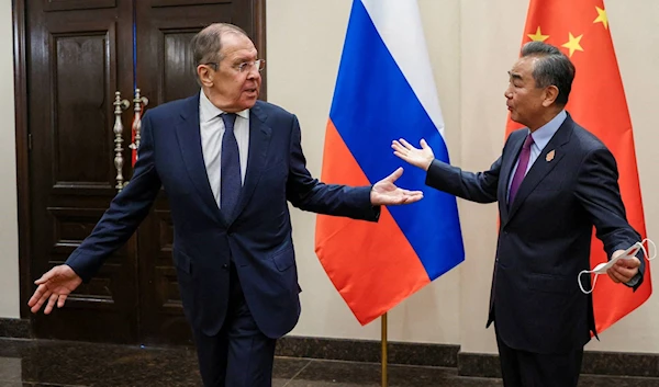 Russian Foreign Minister Sergey Lavrov and Chinese Foreign Minister Wang Yi meet in Denpasar, Indonesia, July 7 2022 (Reuters)