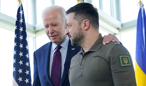 US President Joe Biden walks with Ukrainian President Volodymyr Zelensky ahead of a working session on Ukraine during the G7 Summit in Hiroshima, Japan, Sunday, May 21, 2023. (AP)