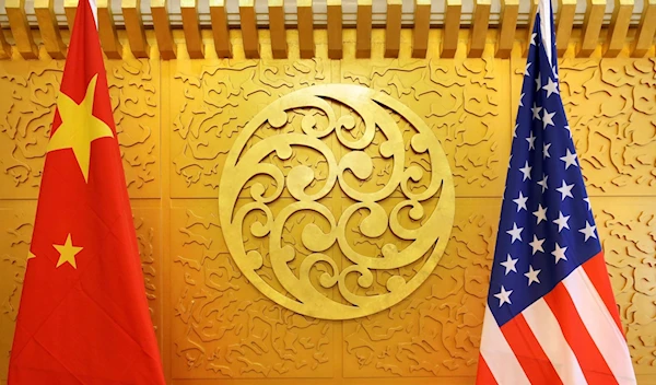 The flag of the People's Republic of China and that of the United States are set up at the Ministry of Transport in Beijing, China, 27 April 2018. (Reuters)