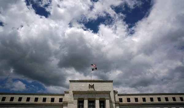 Flags fly over the Federal Reserve Headquarters on a windy day in Washington, U.S., May 26, 2017. (Reuters)