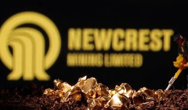 An imitation gold are seen in front of the Newcrest logo in this illustration taken November 19, 2021. (Reuters)