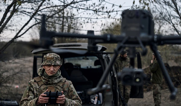 A Ukrainian soldier launches a drone in the area of the heaviest battles with Russian troops in Bakhmut, Donetsk region, Sunday, April 9, 2023 (AP Photo/Libkos, File)