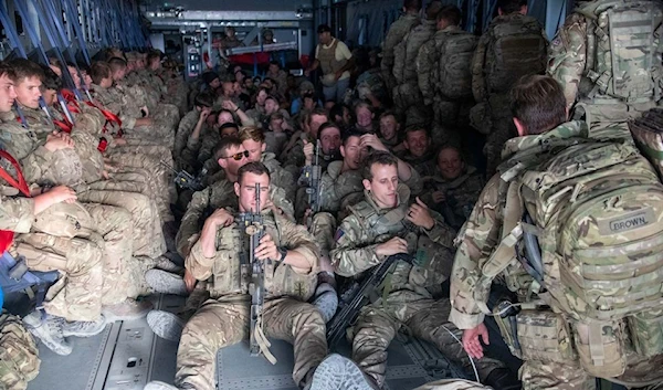 UK military members board an A400M aircraft after the US and its allies hastily exited Afghanistan, 28 August 2021. (Reuters)