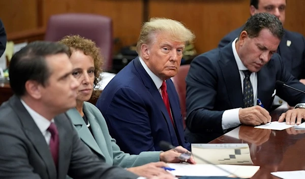 Former President Donald Trump sits at the defense table with his legal team in a Manhattan court, Tuesday, April 4, 2023, in New York (AP Photo/Seth Wenig, Pool)