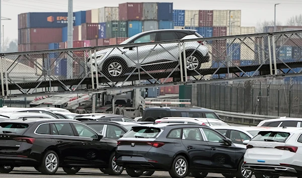 New cars are stored and handled for export at the logistic port in Duisburg, Germany, Tuesday, Jan. 25, 2022. (AP)