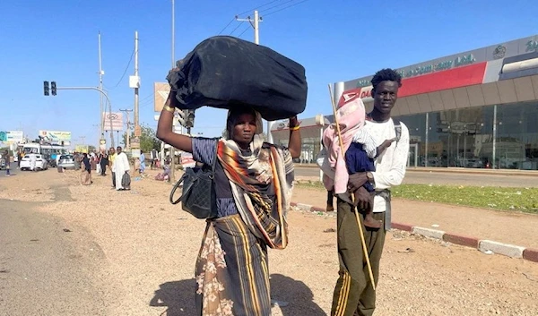 People gather at the station to flee from Khartoum during clashes between the paramilitary Rapid Support Forces and the army in Khartoum, Sudan April 19, 2023. (Reuters)