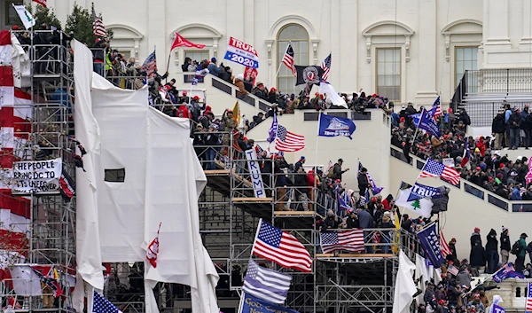 In this Jan. 6, 2021 file photo insurrectionists loyal to President Donald Trump riot outside the Capitol in Washington. (AP)