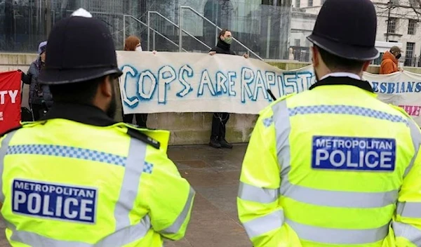 Demonstrators hold banners as they take part in the 'Raise the Alarm' protest outside New Scotland Yard police headquarters, in London, Britain February 18, 2023. (Reuters)