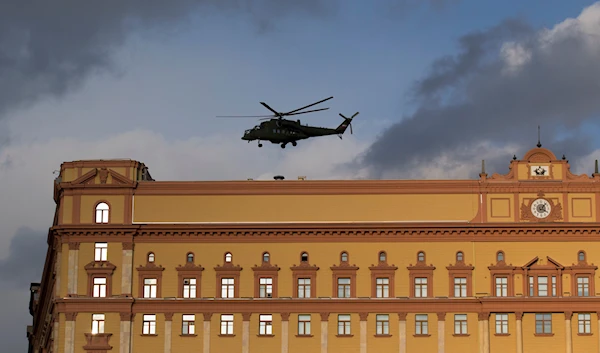 Russian military Mi-35 helicopter takes off from the building of the Federal Security Service (FSB, Soviet KGB successor) in Lubyanskaya Square in Moscow, Russia, Friday, Feb. 26, 2016. (AP)