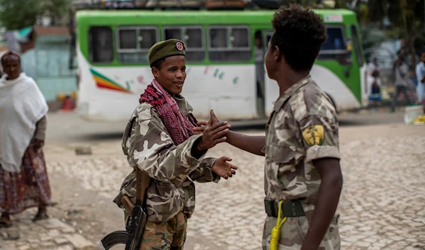 In this Friday, May 7, 2021 file photo, fighters loyal to the Tigray People's Liberation Front (TPLF) greet each other. (AP)