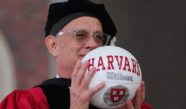 Actor Tom Hanks received an honorary doctor of arts degree from Harvard University during its 372nd commencement on Thursday. He also received a volleyball in tribute to his role in Castaway. May 25 2023 (Reuters)