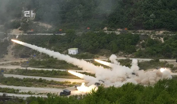 Multiple launch rocket systems of the South Korean army fire at targets during a joint military exercise held by the US and South Korea at the Seungjin Fire Training Field in Pochean, South Korea, May 25 2023. (AP)