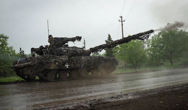 Ukrainian tank fires toward Russian positions at the frontline near Bakhmut, Donetsk region, Tuesday, May 23, 2023 (AP Photo/Efrem Lukatsky)