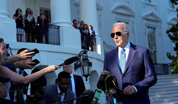 US President Joe Biden talks with reporters on the South Lawn of the White House in Washington, May 26, 2023 (AP)