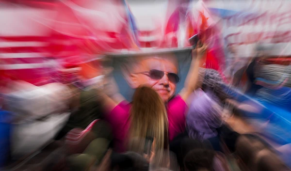 Supporters of President Recep Tayyip Erdogan celebrate outside his residence in Istanbul, Turkey, May 28, 2023 (AP)