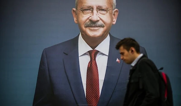 A man walks past a billboard of Turkish CHP party leader and Nation Alliance s presidential candidate Kemal Kilicdaroglu a day after the presidential election day, in Istanbul, Turkey, Monday, May 15, 2023 (AP)