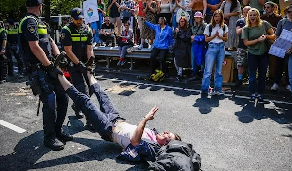 Police arrested climate activist protesting against Dutch fossil fuel subsidies. (AFP)