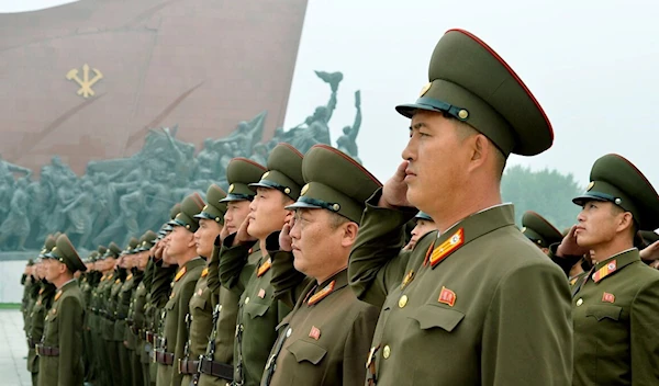 DPRK soldiers salute at Mansudae hill in Pyongyang, North Korea. (Reuters)