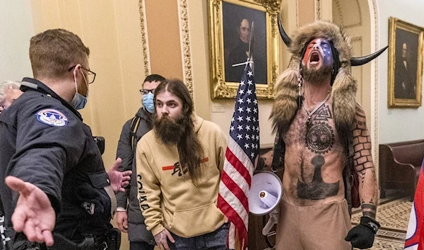 Supporters of President Donald Trump confronted by U.S. Capitol Police officers outside the Senate Chamber Washington,  January 6, 2021 (AP)