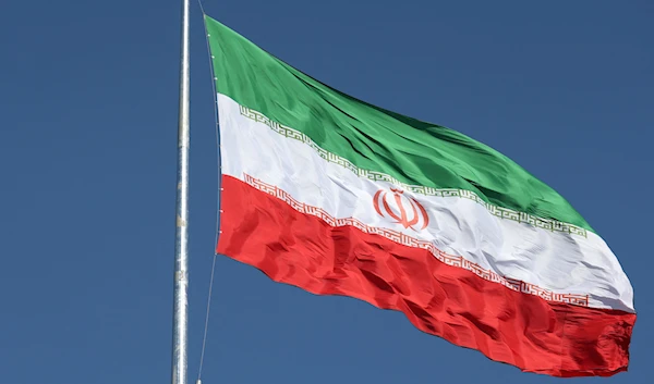 The flag of the Islamic Republic of Iran flied over a street in Tehran, Iran, February 3 2023. (Reuters)