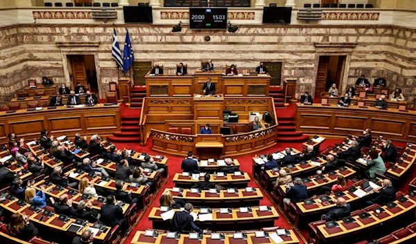 Greek Prime Minister Kyriakos Mitsotakis addresses the Greek Parliament in Athens. (AFP)