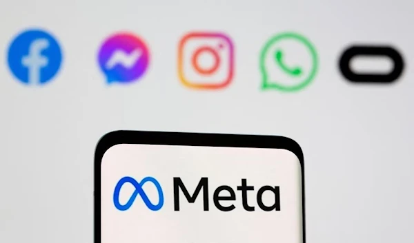 A screen displays Meta's logo in front of the logos of social media applications it owns, 28 October 2021. (Reuters)