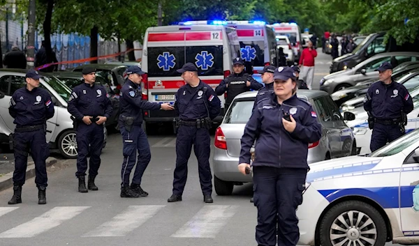 Police block streets around the Vladislav Ribnikar school in Belgrade, Serbia, Wednesday, May 3, 2023 (AP Photo/Darko Vojinovic)