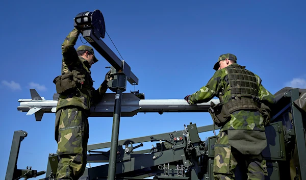 Swedish soldiers take part in a military presentation of the medium-range Patriot air defense missile system in Stockholm, Sweden, April 30, 2023 (AP)