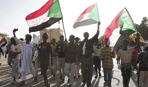 Sudanese protesters take part in a rally against military rule on the anniversary of previous popular uprisings, in Khartoum, Sudan, on April 6, 2023 (AP)