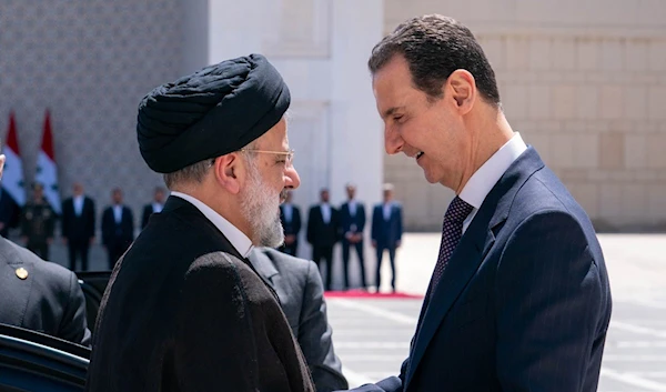 Syria's President Bashar Al Assad warmly greets Iran's President, Ebrahim Raisi, as arrives in Damascus, Syria to hold bilateral talks, 3 May 2023. (SANA)