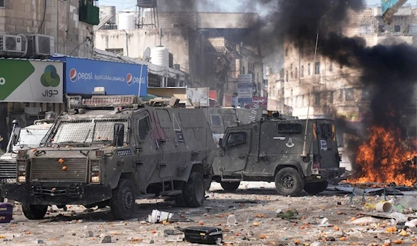 Israeli occupation forces during a raid on Nablus in 2023 (AP)