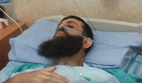 In this image, Palestinian Martyr Khader Adnan is seen suffering from extremely difficult health conditions.in a hospital bed in Israeli prison on his 80th day of hunger strike.