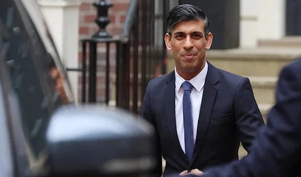 Rishi Sunak leaves the Conservative Party campaign headquarters after addressing supporters on May 2023. (Reuters)