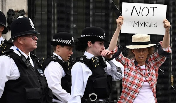 An anti-monarchy demonstrator protests outside Palace of Westminster in central London. (AFP)