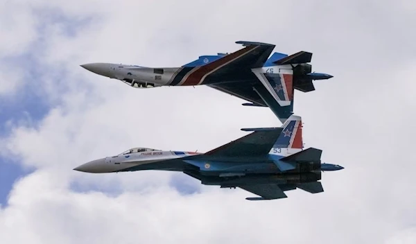 Russian Sukhoi Su-35S jet fighters perform aerial maneovers during an air show in Zhukovski, Russia, 25 July 2021. (Reuters)