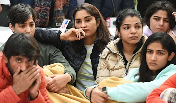 Bajrang Punia, Vinesh Phogat, and Sakshi Malik protest against the authorities who are covering up an alleged sexual harrasment complaint against the Wrestling Federation of India (WFI), Dehli, India. (AFP)